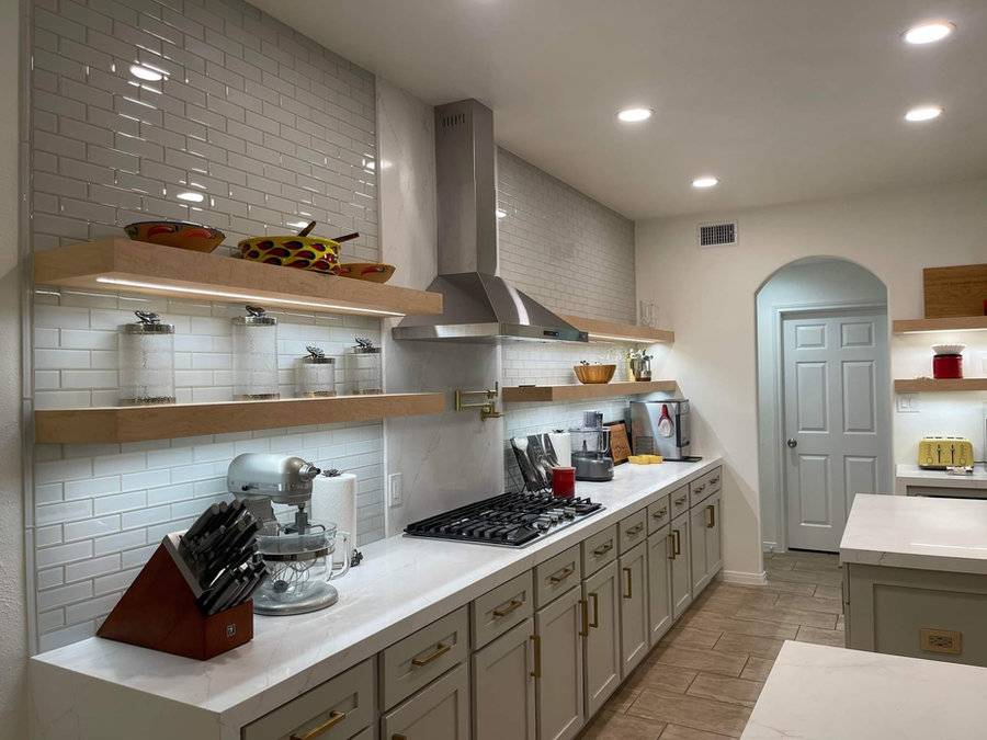 Kitchen with open shelving and subway tile