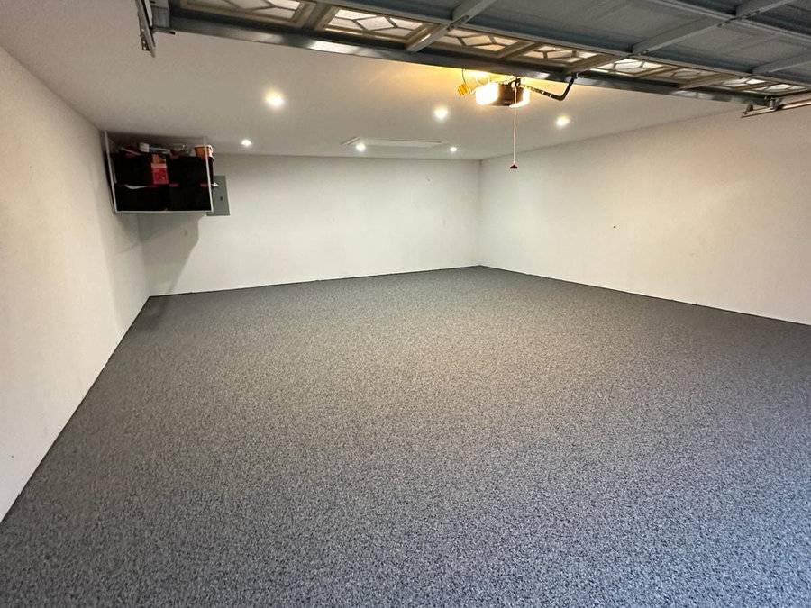 Garage with a finished grey epoxy floor coating